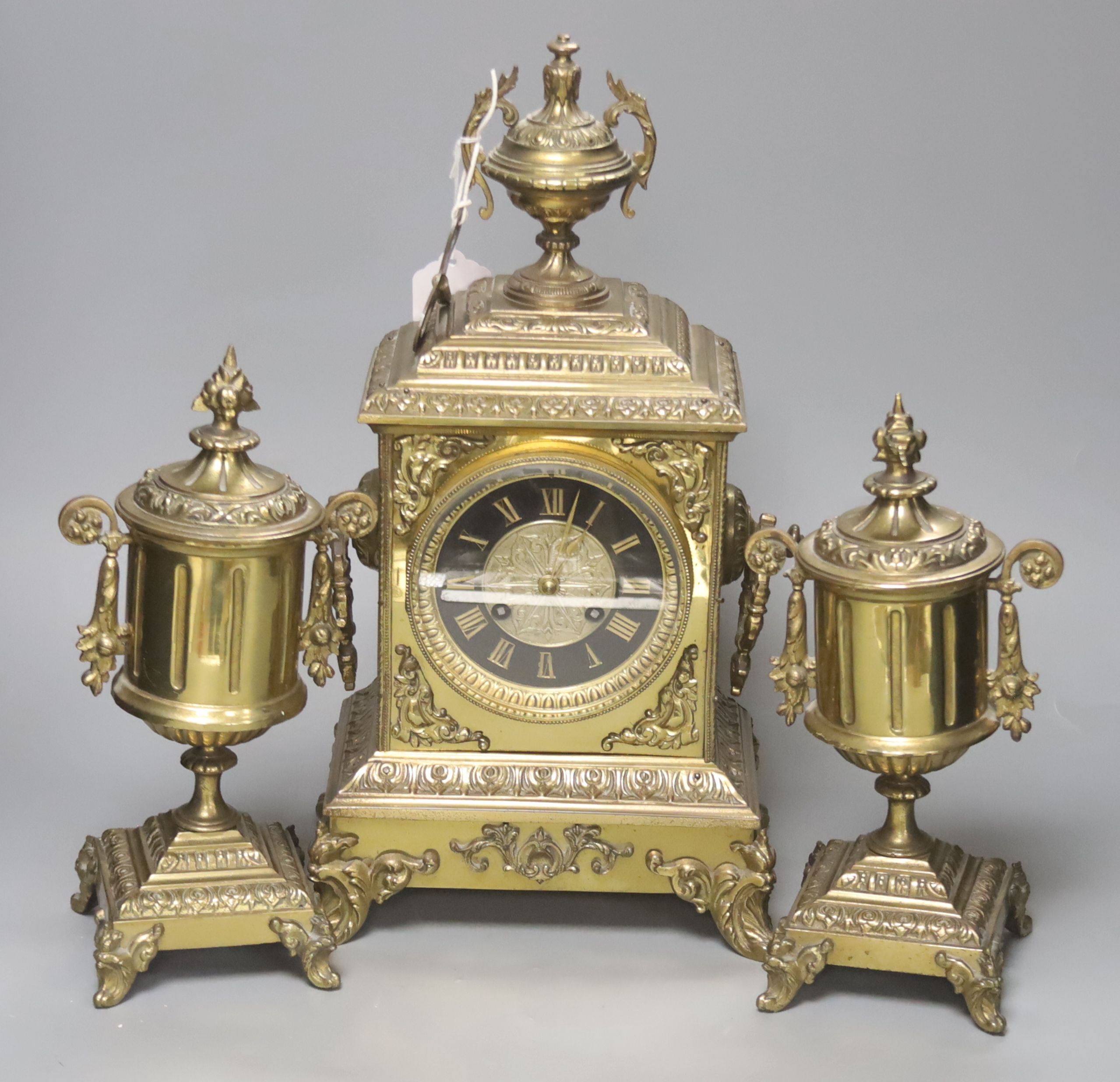 A French brass ornate clock garniture, with French movement, clock height 41cm